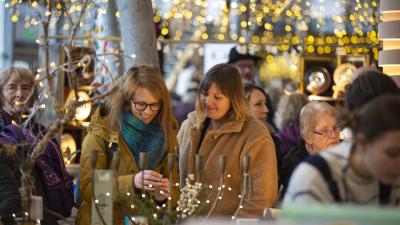 People shopping at a sparkly Christmas fair